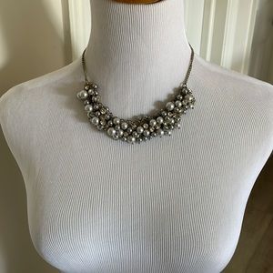 Lost adjustable necklace. Gray pearls with a gold claim with clear crystal gems.